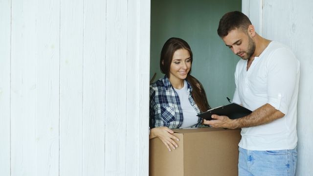 two people looking at a checklist indoors