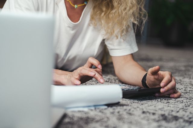 person budgeting with a calculator